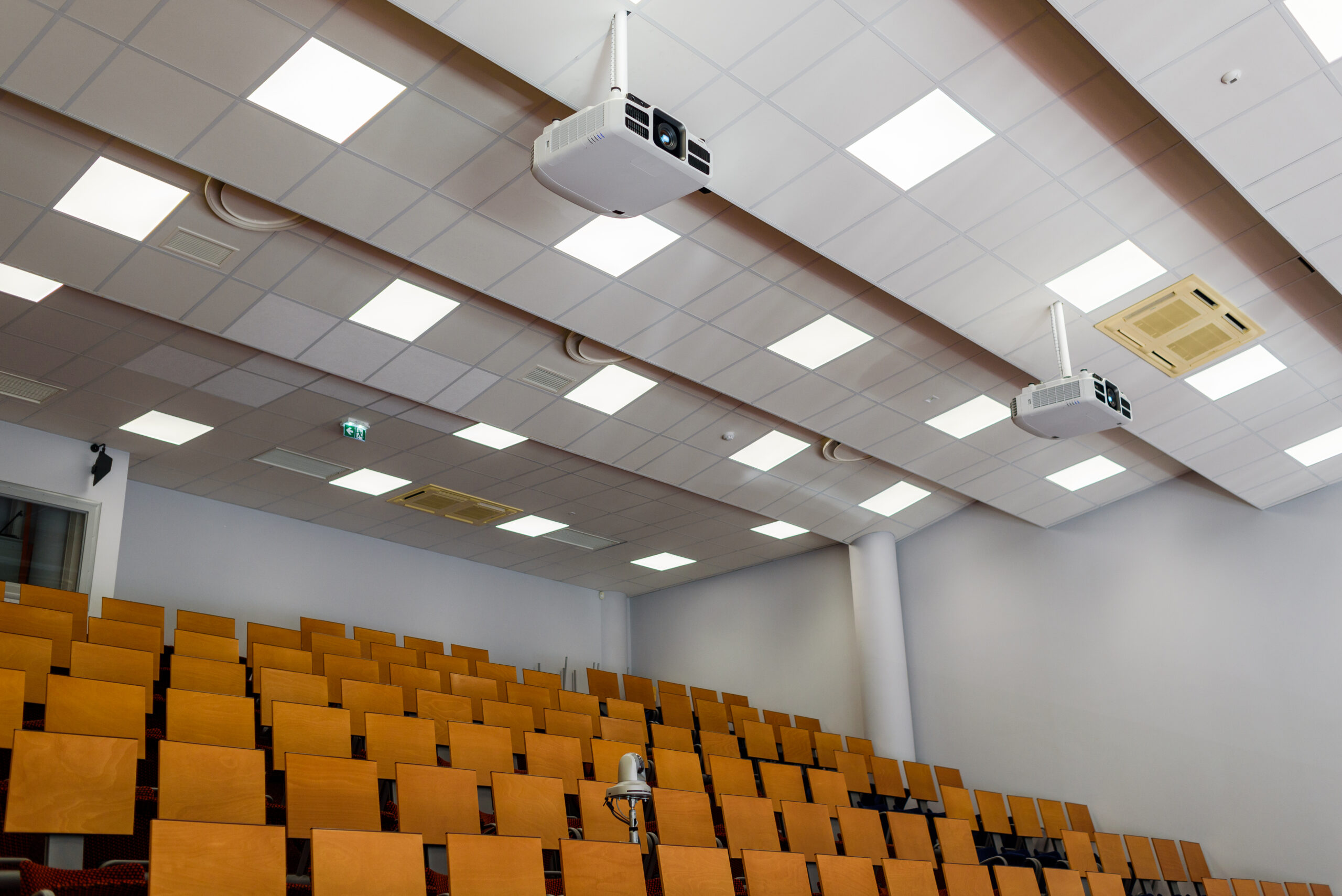 Empty university classroom with media equipment: projector, camera, audio system. For distance learning.
